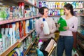 Women selecting detergents in store Royalty Free Stock Photo