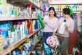 Women selecting detergents in store . Royalty Free Stock Photo