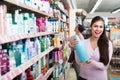 Women selecting hair care in store