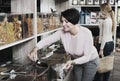 Women selecting nuts in store Royalty Free Stock Photo