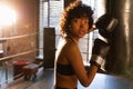 Women self defense girl power. African american woman fighter resting after fight training on boxing ring. Girl tired