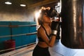 Women self defense girl power. African american woman fighter resting after fight training on boxing ring. Girl tired