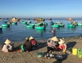 Women sell fishes on the beach in Phan Rang, Vietnam