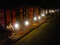 Women sell souvenirs at Laotian night market