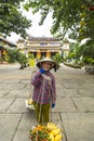 Women selling fruit in the streets of Hoi An