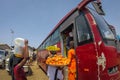 women selling goods to bus passengers