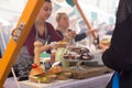 Women serving hamburgers on food festival in Ljubljana, Slovenia. Royalty Free Stock Photo