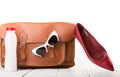 women set with leather bag, shoes, sunglasses and bottle of water isolated on white Royalty Free Stock Photo