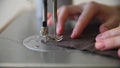 Women sewing brown flax with sewing machine