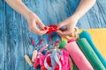 Women sews by hand and making handmade heart