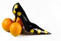 Women shoe with three oranges Royalty Free Stock Photo