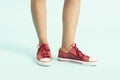 Women shoes. sports shoes ,sneakers. Closeup of woman legs and feet wearing red shoes Royalty Free Stock Photo