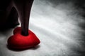 women shoes stomp on broken heart in dark tone., unrequited love Royalty Free Stock Photo