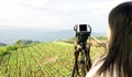 Women shooting photo or video of landscape sky and mountain nature view Royalty Free Stock Photo