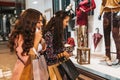 Two happy girl with shopping bags enjoying in shopping, having fun in the city Royalty Free Stock Photo