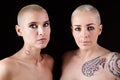 Women with short hair and tattoos Royalty Free Stock Photo