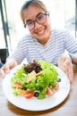 Women show fresh salad