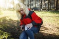 Women sign geocaching logbook