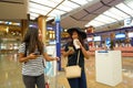 Women at Singapore Changi Airport Terminal 2 departure hall Royalty Free Stock Photo