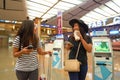 Women at Singapore Changi Airport Terminal 2 departure hall Royalty Free Stock Photo