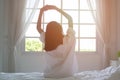 women sit at the edge of the bed Royalty Free Stock Photo