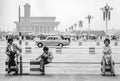 women sit at the Tianmen place in china with very low traffic