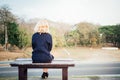 A women sitting alone on a bench waiting for love Royalty Free Stock Photo