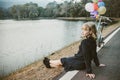 A women sitting alone on the road waiting for love, alone concept Royalty Free Stock Photo