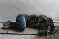 Women sleeping on the roadside