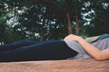 Women sleeping on wood chair