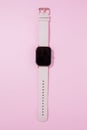 A women smart watch on pink background