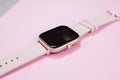 A women smart watch on pink background