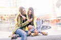 Women with smartphones in a bar