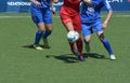 Women soccer players scrimmage on a soccer field