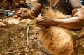 Women spin coconut hair by hand, turning it into a strong rope