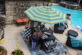 Women standing around patio table beside swimming pool with nice outdoor furniture - top view Tulsa OK