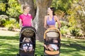 Women standing with the baby stroller Royalty Free Stock Photo