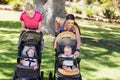 Women standing with the baby stroller Royalty Free Stock Photo