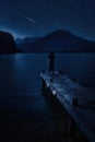 woman and mountain lake at night mysterious star moon sky Royalty Free Stock Photo