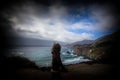 Women starring at the ocean