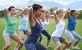 Women, stretching and squats for exercise outdoor, team and ready for workout with health and wellness. Training Royalty Free Stock Photo