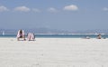 Women sunbathe on the Arenal beach in Mallorca. Royalty Free Stock Photo