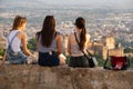 Women and sunset over Granada and Alhambra