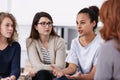 Women supporting each other during psychotherapy group meeting Royalty Free Stock Photo