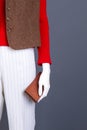 Women sweater, brown waistcoat and wallet. Royalty Free Stock Photo