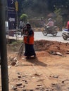 Women sweeping street in odisha a state of india