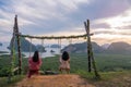 Women on swing look view of Samed Nang Chee