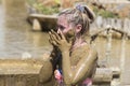 Women take therapeutic mud baths to improve