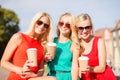 Women with takeaway coffee cups in the city Royalty Free Stock Photo