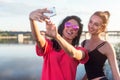 Women taking picture of herself, selfie at beach Lifestyle sunny image best friend girls happy vacations.